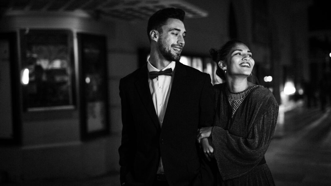 charming-attractive-cheerful-woman-walking-with-young-man-street