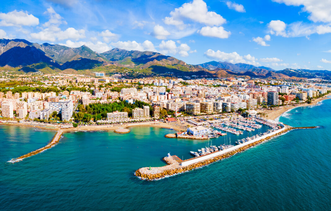 Marbella city port and beach aerial panoramic view